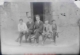 Grupo de 4 alumnos y un profesor sentados en un banco, 1925