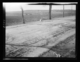 Ladrillos. Vista lejana de un tejar, con un campo arado en primer plano · Ruth Matilda Anderson, 1928
