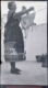 Mujer con traje típico tendiendo, 1950
